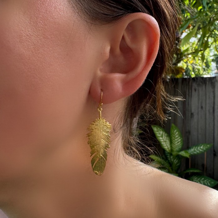 gold feather earrings